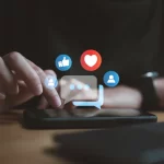 a-person-interacts-with-a-smartphone-on-a-table