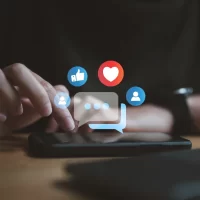 a-person-interacts-with-a-smartphone-on-a-table